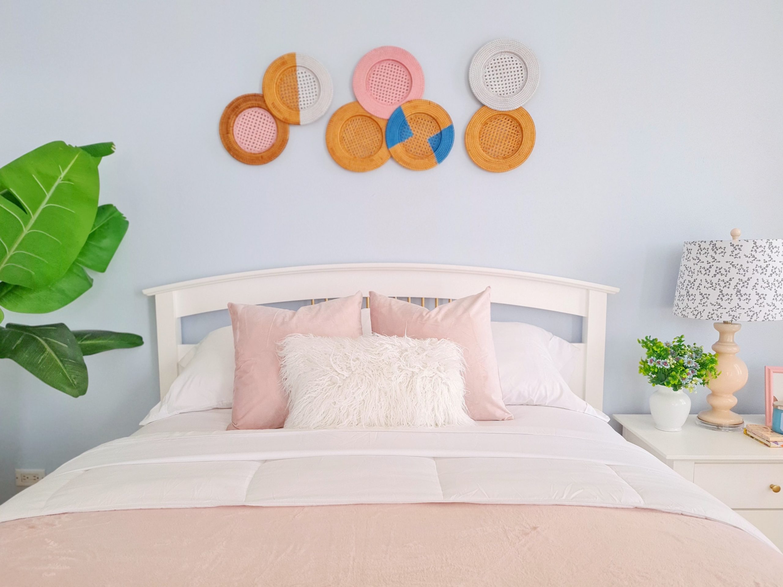 Dreamy coastal bedroom with sky blue walls and pastel pink décor.